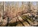 Picturesque creek flowing through a tranquil wooded area on the estate property at 7260 N 225 W, Lebanon, IN 46052