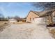 Property featuring an additional building with gravel driveway and spacious attached garage at 7260 N 225 W, Lebanon, IN 46052