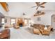 Cozy living room with a fireplace, ceiling fans, and comfortable seating arrangement at 7260 N 225 W, Lebanon, IN 46052