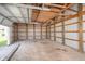 Empty storage area with a roll up door; includes shelving and a concrete floor at 7260 N 225 W, Lebanon, IN 46052