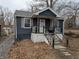Charming home with a cozy front porch and mature trees in a quiet neighborhood at 730 Waldemere Ave, Indianapolis, IN 46241