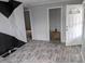 Inviting living room featuring durable laminate floors and freshly painted gray walls at 730 Waldemere Ave, Indianapolis, IN 46241