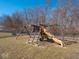 Large backyard with a swing set, providing an ideal space for outdoor play and Gathering activities at 7536 Shasta Dr, Indianapolis, IN 46217