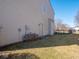 Side view of home with a door leading to the backyard at 7536 Shasta Dr, Indianapolis, IN 46217
