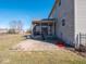 View of the backyard with a screened porch, patio, and a grassy area, enhancing outdoor living space at 7536 Shasta Dr, Indianapolis, IN 46217