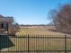 Large backyard with a wrought iron fence, offering both privacy and a clear view of the neighborhood at 7536 Shasta Dr, Indianapolis, IN 46217