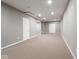 Finished basement offers ample space, neutral carpeting and recessed lighting at 7536 Shasta Dr, Indianapolis, IN 46217