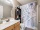 Bathroom featuring a white vanity and a shower with a decorative curtain at 7536 Shasta Dr, Indianapolis, IN 46217