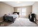 Cozy bedroom with carpet flooring and natural light at 7536 Shasta Dr, Indianapolis, IN 46217