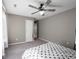 Bedroom featuring plush carpeting, ceiling fan and ample natural light at 7536 Shasta Dr, Indianapolis, IN 46217