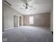 Large bedroom with vaulted ceiling, ceiling fan, and neutral-colored carpet at 7536 Shasta Dr, Indianapolis, IN 46217