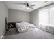 Bedroom featuring plush carpeting, ceiling fan and ample natural light at 7536 Shasta Dr, Indianapolis, IN 46217