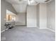 Expansive bedroom has vaulted ceiling, large window, and neutral-colored carpet at 7536 Shasta Dr, Indianapolis, IN 46217