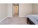 Neutral bedroom featuring plush carpeting and access to a bathroom at 7536 Shasta Dr, Indianapolis, IN 46217