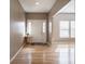 The front entry features hardwood floors, a coat closet, and natural lighting at 7536 Shasta Dr, Indianapolis, IN 46217