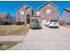 Attractive brick home with a two-car garage and a driveway with parking for multiple cars at 7536 Shasta Dr, Indianapolis, IN 46217
