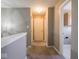 Hallway boasts neutral walls and carpet, with doors leading to various rooms at 7536 Shasta Dr, Indianapolis, IN 46217