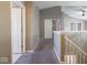 Upstairs hallway features neutral walls and carpet, with access to multiple rooms at 7536 Shasta Dr, Indianapolis, IN 46217