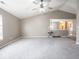 Bright living room with vaulted ceilings, a ceiling fan, and gray carpet flooring at 7536 Shasta Dr, Indianapolis, IN 46217