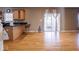Bright living room features wood floors, slider doors, and a convenient wet bar for entertaining guests at 7536 Shasta Dr, Indianapolis, IN 46217