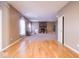 Spacious living room featuring hardwood floors transitioning to carpet and a cozy fireplace with brick surround at 7536 Shasta Dr, Indianapolis, IN 46217