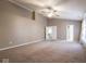 Spacious carpeted main bedroom featuring ensuite bathroom and double door closet at 7536 Shasta Dr, Indianapolis, IN 46217