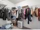Organized walk-in closet featuring metal shelving and carpet flooring at 7536 Shasta Dr, Indianapolis, IN 46217