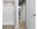 Bright bathroom with white shower stall, wood look flooring, and modern fixtures at 766 N Bancroft St, Indianapolis, IN 46201