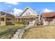 Charming two-story home with a well-maintained front yard and inviting walkway to the front door at 766 N Bancroft St, Indianapolis, IN 46201