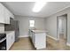 Modern kitchen featuring stainless steel appliances, granite countertops, and white cabinets at 766 N Bancroft St, Indianapolis, IN 46201