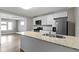 Bright kitchen featuring a peninsula island, stainless steel appliances, and modern cabinetry at 766 N Bancroft St, Indianapolis, IN 46201
