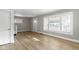 Inviting living room with large windows and wood floors at 766 N Bancroft St, Indianapolis, IN 46201