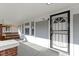 Inviting front porch with a swing and secure front door with black security door for peace of mind at 766 N Bancroft St, Indianapolis, IN 46201