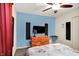 Modern bedroom design featuring vibrant decor and a flat screen TV on the wall, perfect for cozy evenings at 7939 Crackling Ln, Indianapolis, IN 46259