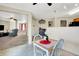 Charming breakfast nook transitions to the living room with a view of the staircase at 7939 Crackling Ln, Indianapolis, IN 46259