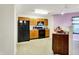 Well-lit kitchen featuring a full suite of black appliances at 7939 Crackling Ln, Indianapolis, IN 46259