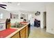 The kitchen features a double sink, wooden cabinets, and opens to the living area of the home at 7939 Crackling Ln, Indianapolis, IN 46259