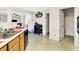 The kitchen features a double sink, wooden cabinets, and opens to the living area of the home at 7939 Crackling Ln, Indianapolis, IN 46259