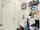The laundry room is well-stocked and has an utility sink, storage shelving and exterior door to the side yard at 7939 Crackling Ln, Indianapolis, IN 46259