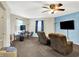 Comfortable upstairs living room with plush seating, desk area and a large television at 7939 Crackling Ln, Indianapolis, IN 46259