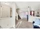 Inviting living room with a staircase, open layout, and seamless flow to other living spaces at 7939 Crackling Ln, Indianapolis, IN 46259