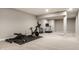 Finished basement gym with various workout equipment and soft carpet flooring offers a great exercise space at 804 Whispering Oaks Dr, Carmel, IN 46032