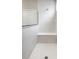 Bathroom featuring a walk-in shower with a glass partition, seat and marbled tile surround at 804 Whispering Oaks Dr, Carmel, IN 46032