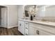 A modern bathroom featuring a double sink vanity, granite counters, and white cabinets at 804 Whispering Oaks Dr, Carmel, IN 46032