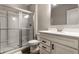 Bathroom featuring a shower with glass doors and a white vanity cabinet with a white countertop at 804 Whispering Oaks Dr, Carmel, IN 46032
