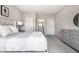 A bedroom showing a queen bed, two closets, and a view into the en-suite bathroom at 804 Whispering Oaks Dr, Carmel, IN 46032