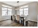 Dining room with natural light, wood floors, a chandelier, and modern decor at 804 Whispering Oaks Dr, Carmel, IN 46032