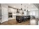 Modern kitchen with stainless steel appliances, granite countertops, and a center island with seating at 804 Whispering Oaks Dr, Carmel, IN 46032