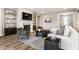 Comfortable living room showcasing a fireplace, large TV, stylish seating, and modern decor at 804 Whispering Oaks Dr, Carmel, IN 46032