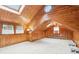 Attic features wood-paneled walls, carpet, and skylights at 8190 Jordan Ln, Indianapolis, IN 46240